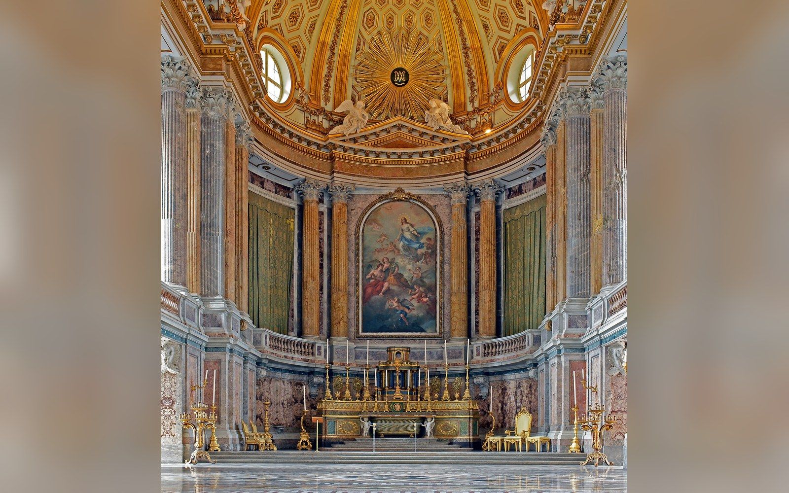 Ornate palatine chapel with a domed painted ceiling, marble columns and a gilded altar